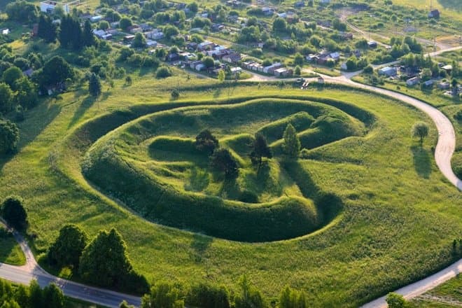 Concrete WWI bunker overgrown with trees and moss near Alytus