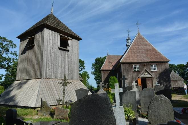 Tiny wooden chapel on an island in Lake Beržoras connected by a footbridge
