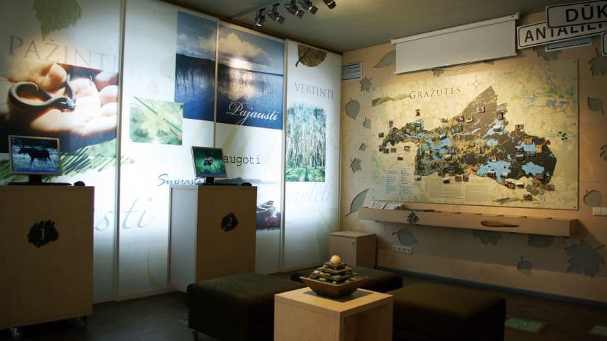 Crystal-clear lake surrounded by pine forest in Gražutė Regional Park