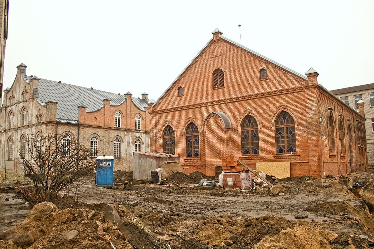 Red-brick ruins of the Joniškis synagogue against the sky