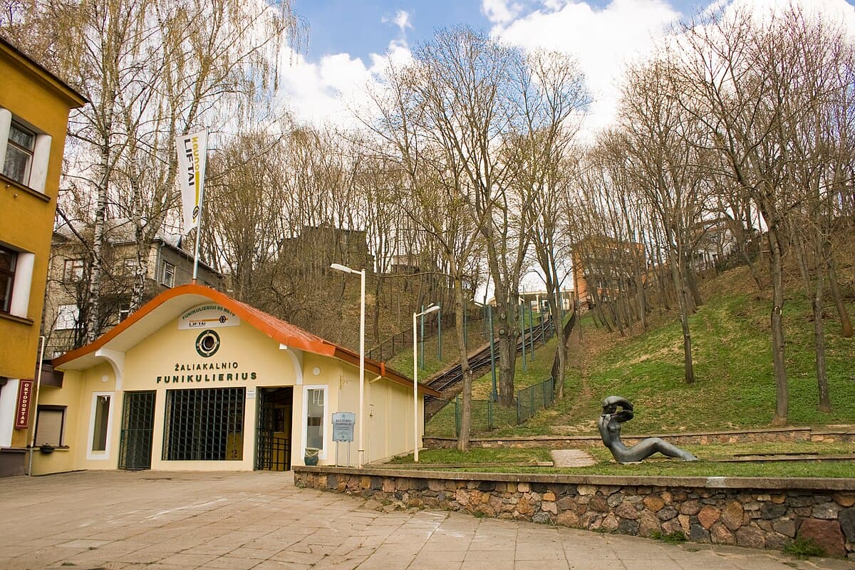 Vintage wooden carriage of the Žaliakalnis Funicular ascending the hillside in Kaunas