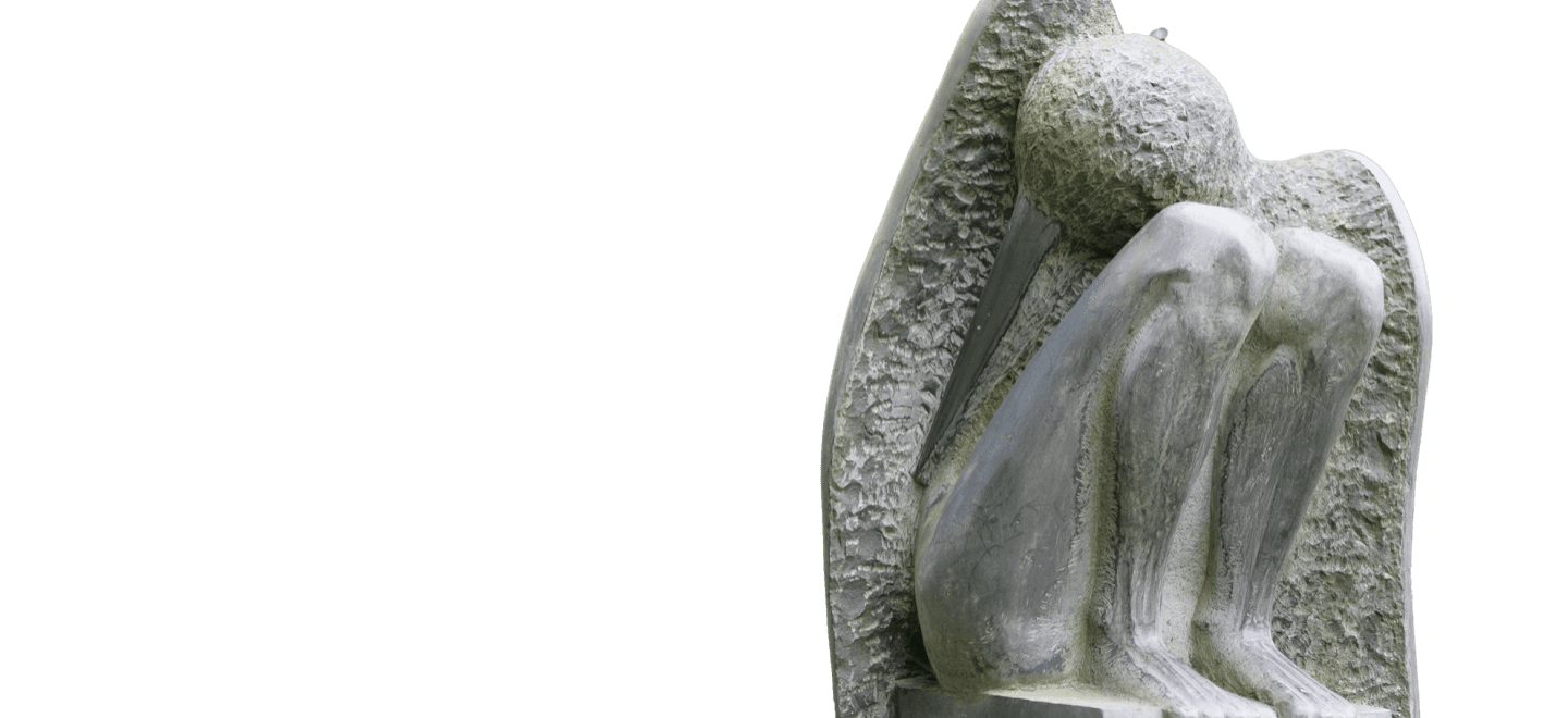 Granite sculptures among trees in the Klaipėda Sculpture Park