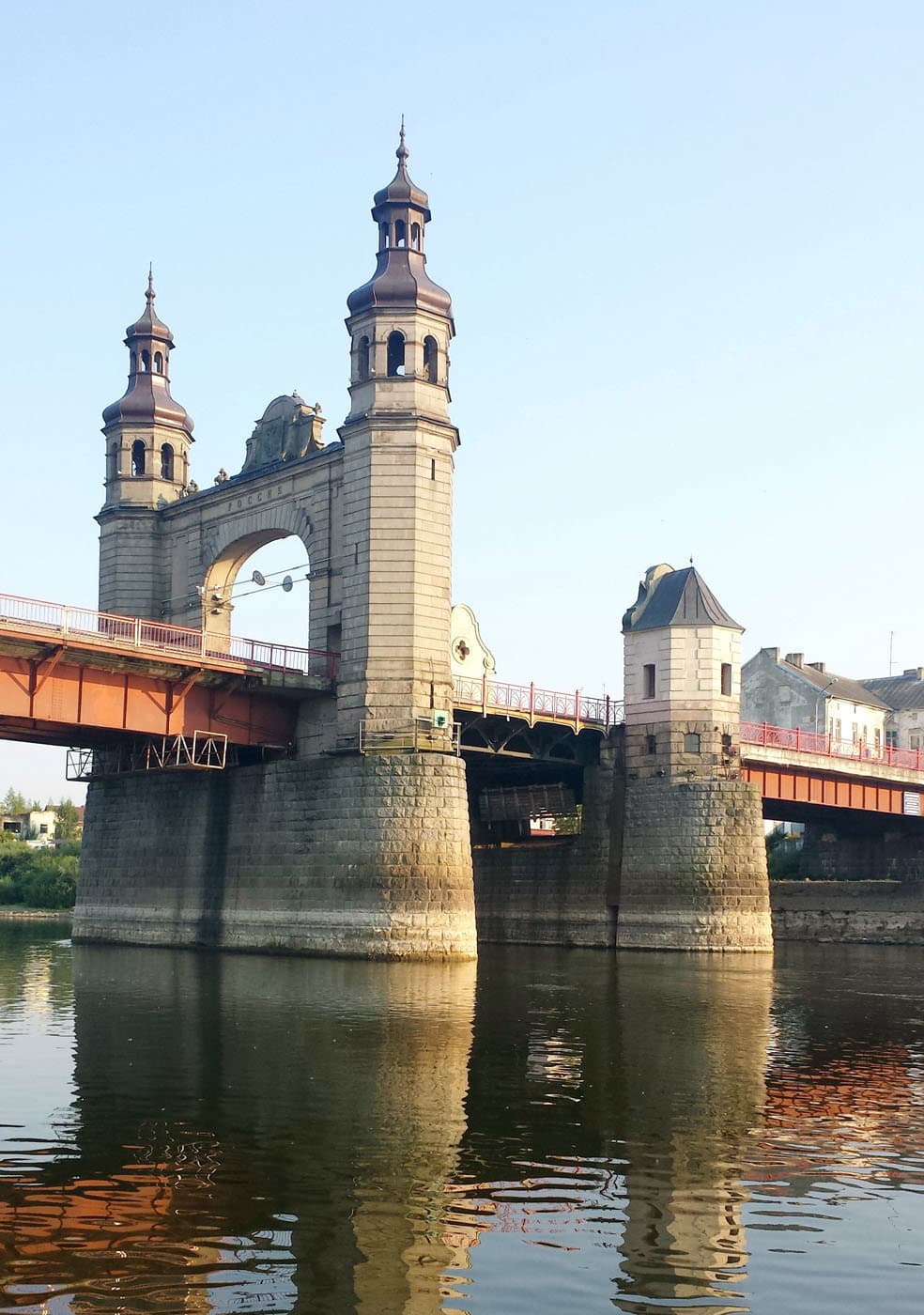 The hand-operated Lūžija drawbridge raised for a passing boat in the Nemunas Delta