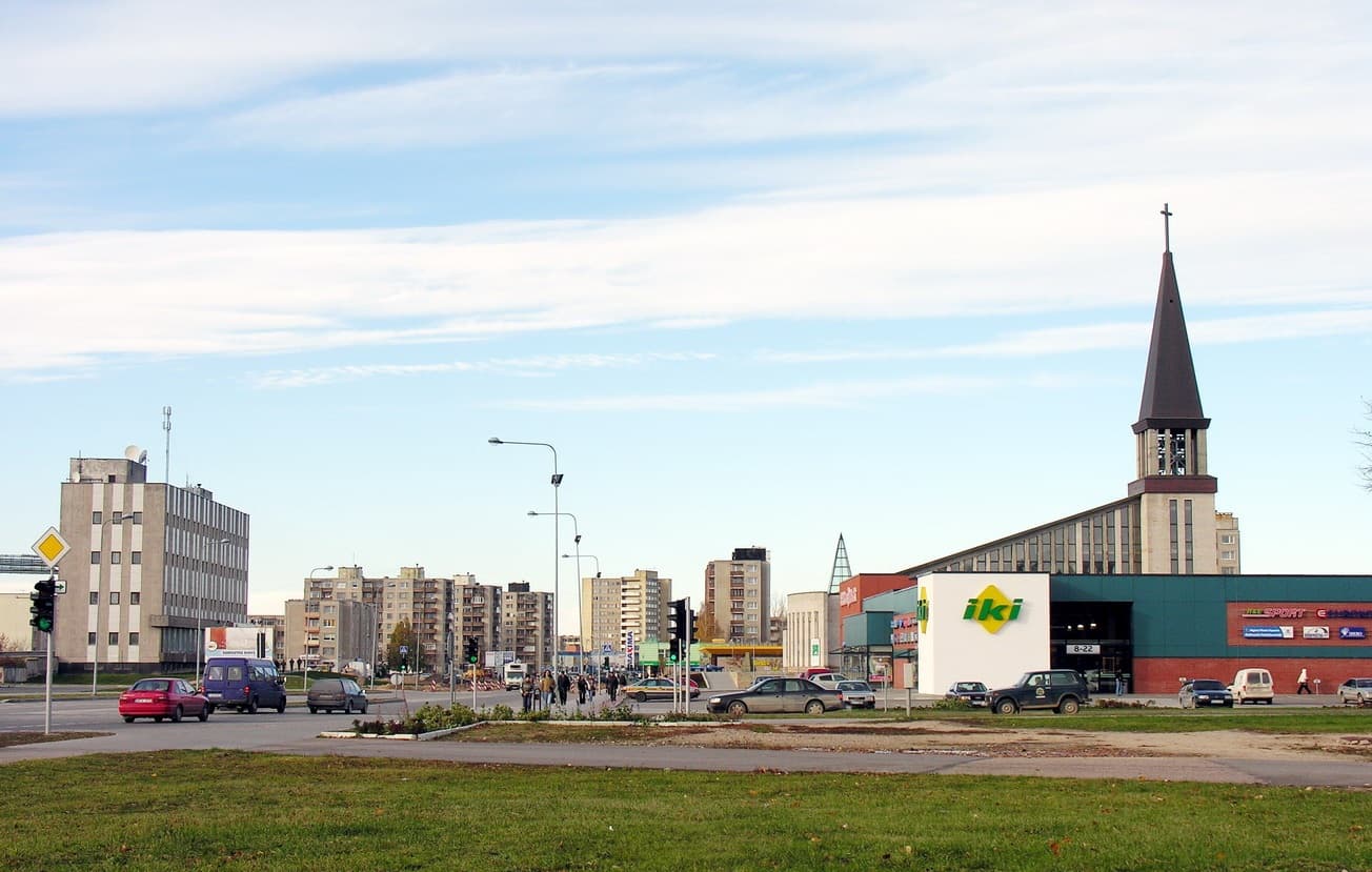 Illuminated towers and chimneys of the Mažeikiai oil refinery at night