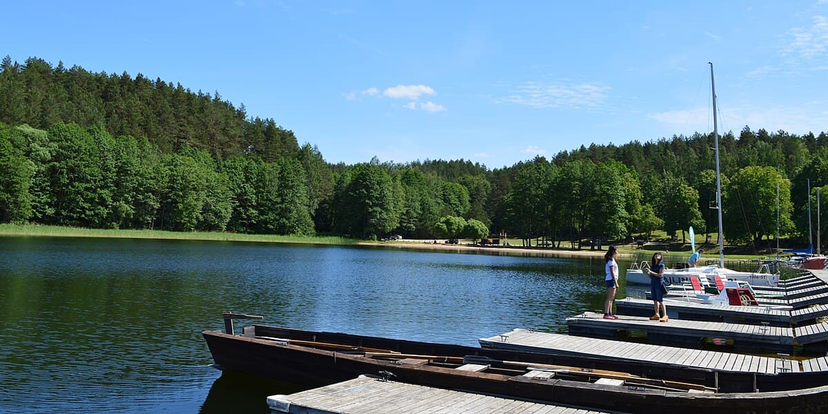 Wooden Palūšė Church on the shore of Lake Lūšiai