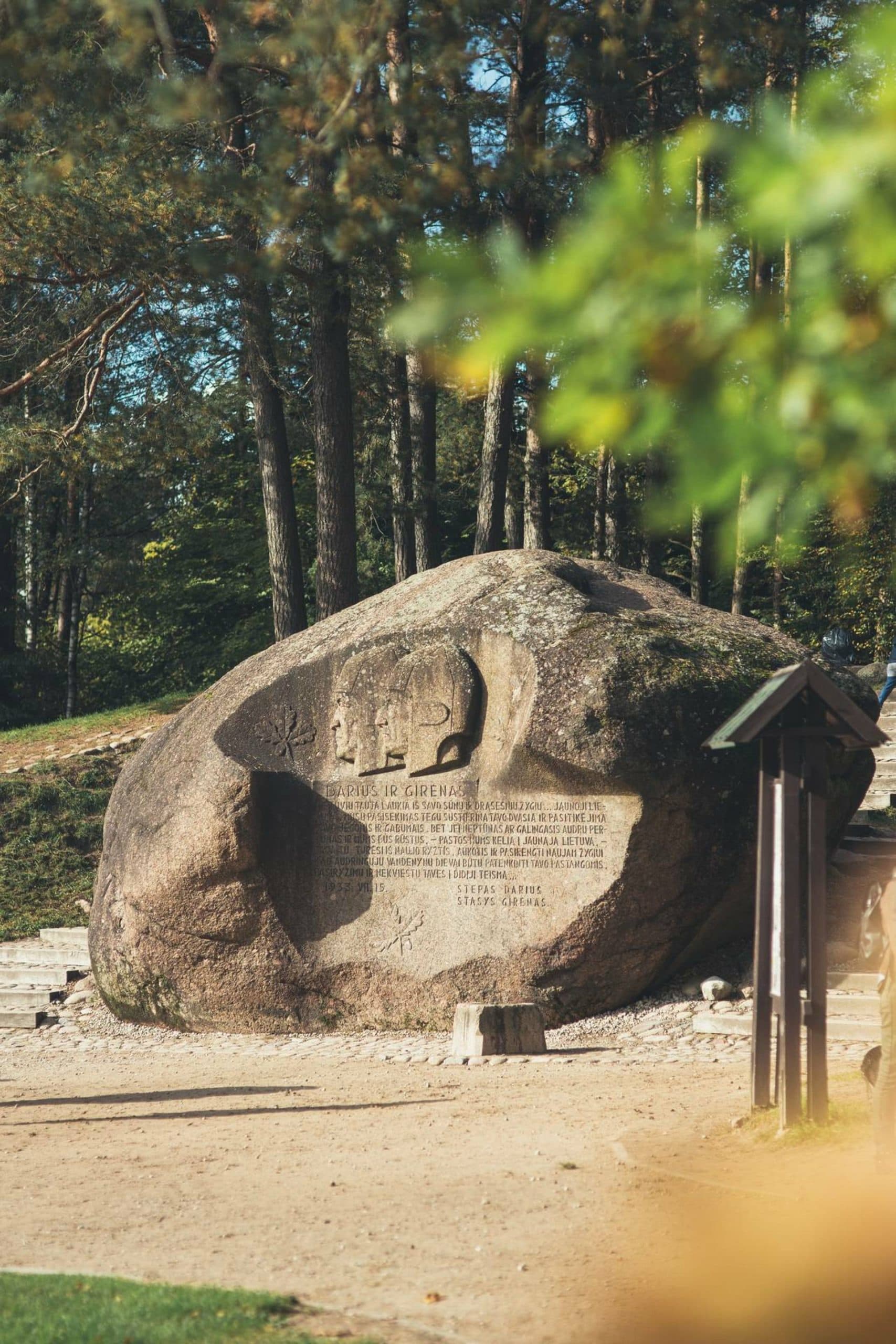Massive Puntukas boulder with carved bas-reliefs of Lithuanian pilots