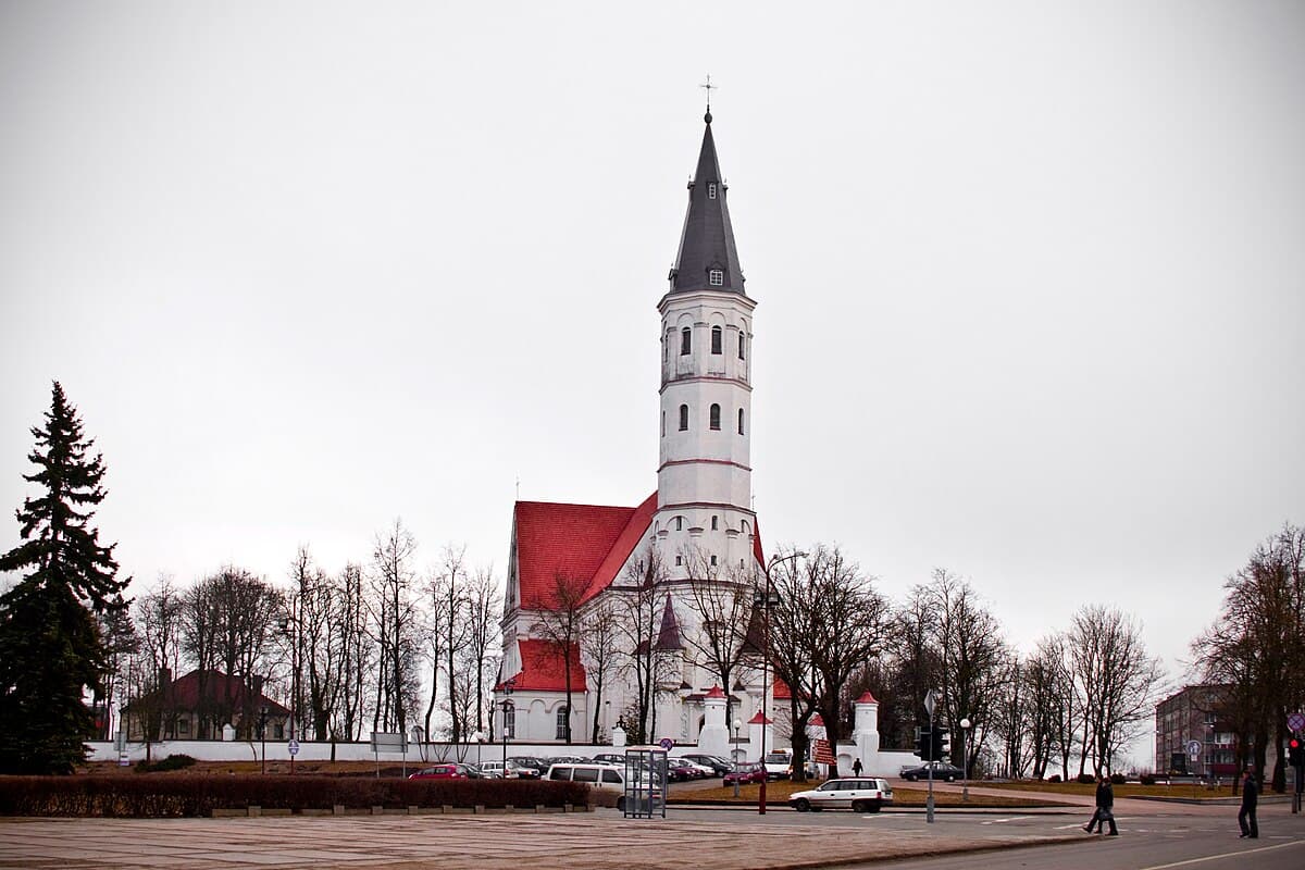The elegant Renaissance tower of Šiauliai Cathedral against a blue sky