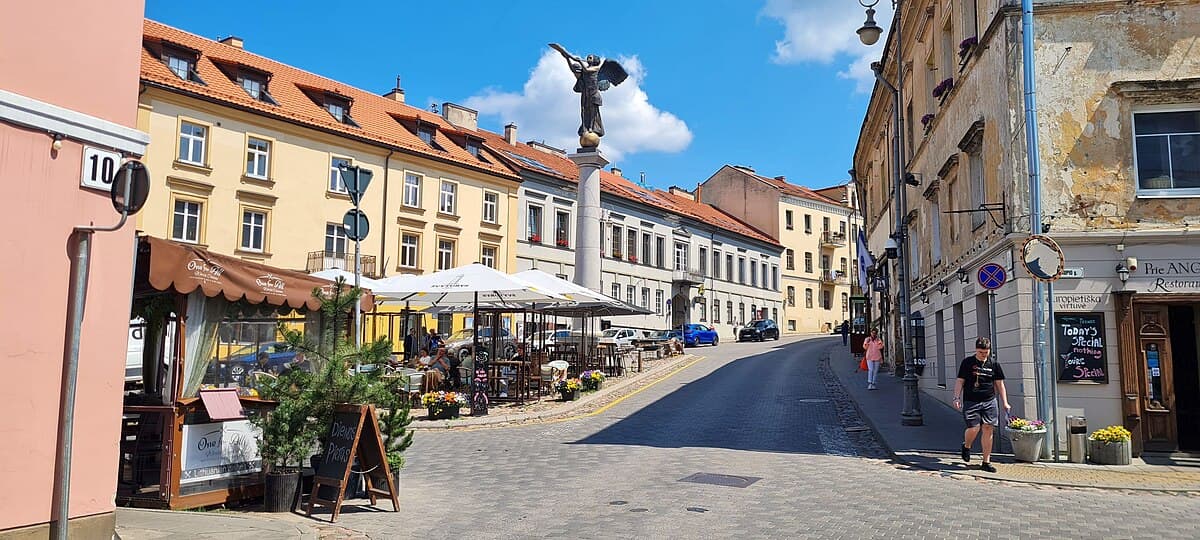 Bronze angel statue atop a column in the heart of Užupis, Vilnius