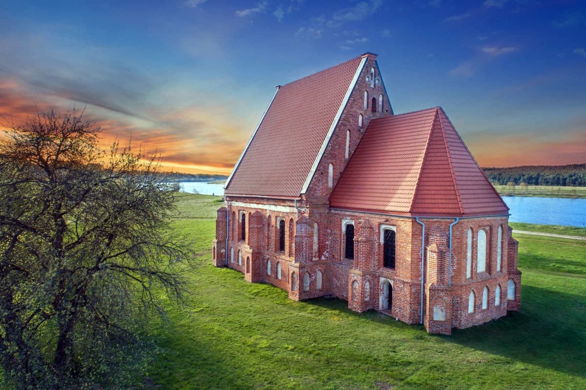 Zapyškis Gothic church reflected in Nemunas River floodwaters
