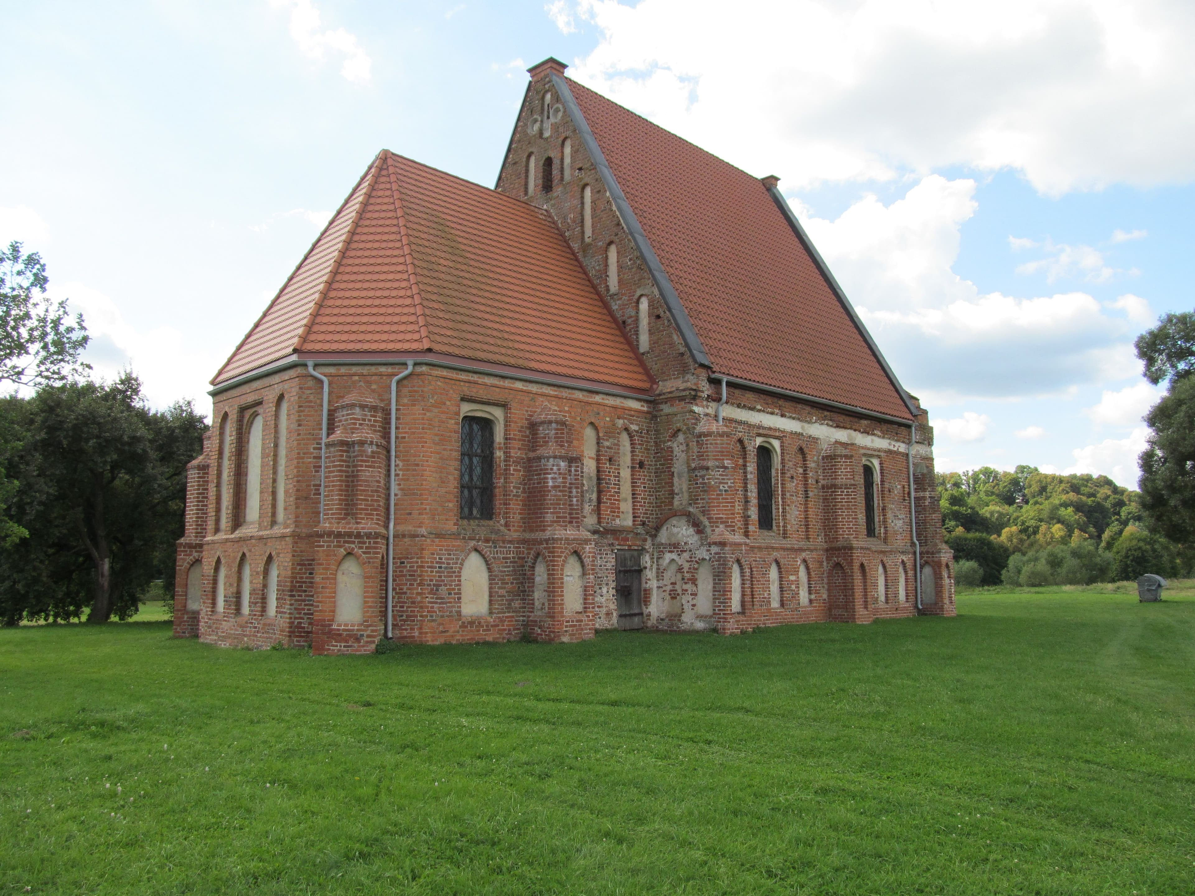 Gothic Zapyškis Church reflected in Nemunas River floodwaters